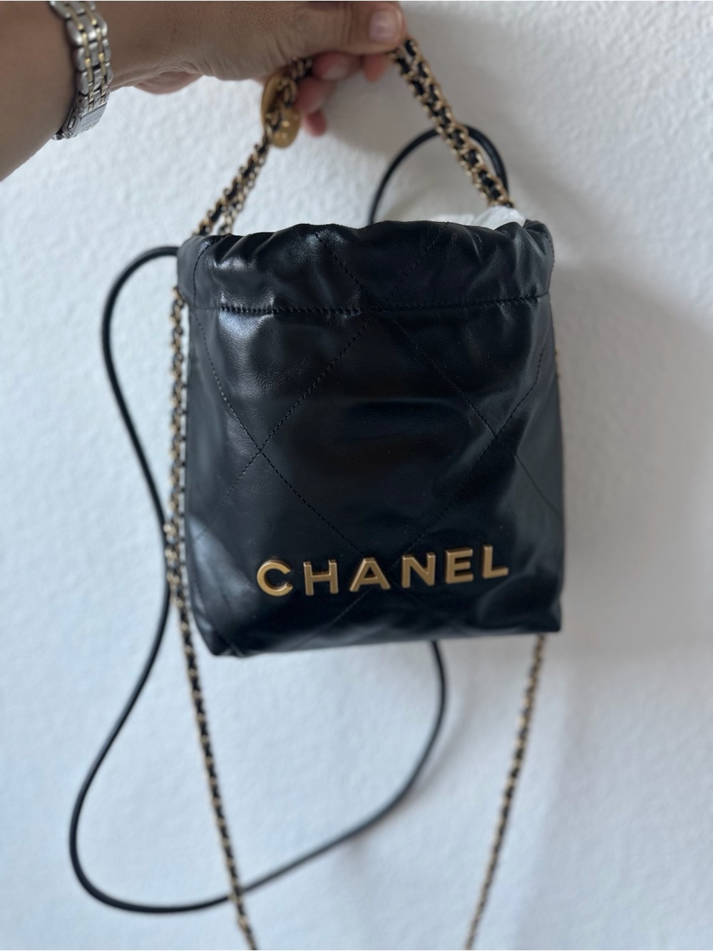 CHANEL Black Quilted Leather Mini 22 Drawstring with Gold Logo